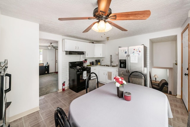 2197 Bayfield Dr, Columbus, OH 43229 - dining room with ceiling fan and a textured ceiling