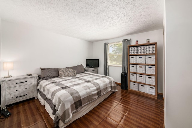 2197 Bayfield Dr, Columbus, OH 43229 - bedroom featuring dark wood-style floors and a textured ceiling
