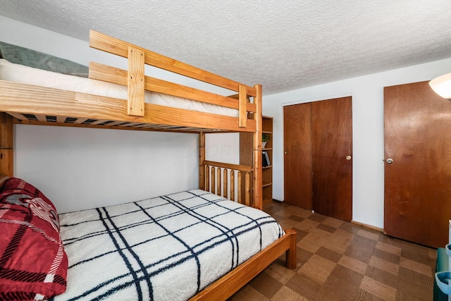 2197 Bayfield Dr, Columbus, OH 43229 - bedroom featuring tile patterned floors and multiple closets