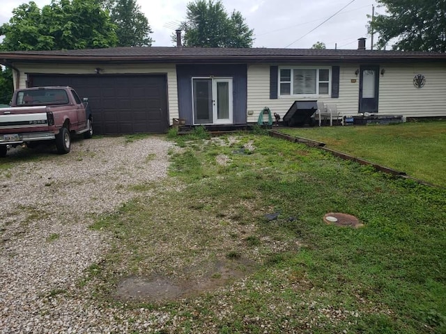 28462 Osborne Rd, Coolville, OH 45723 - ranch-style home with driveway, an attached garage, entry steps, and a front lawn