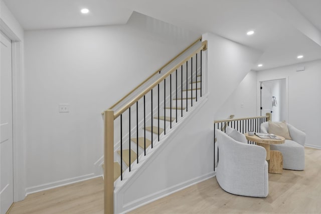 583 E Walnut St, Columbus, OH 43215 - stairway with wood finished floors and recessed lighting