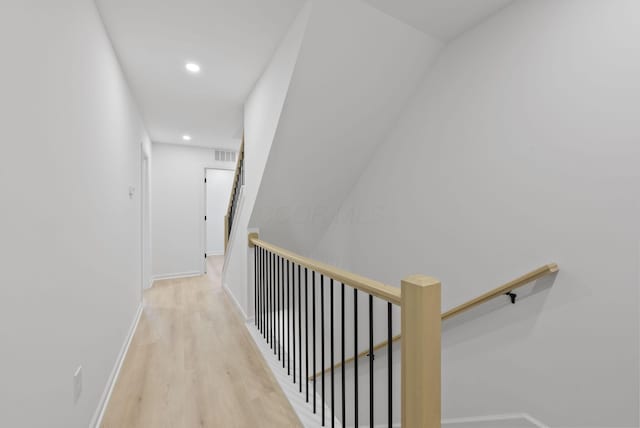 583 E Walnut St, Columbus, OH 43215 - hall featuring wood finished floors, an upstairs landing, and recessed lighting