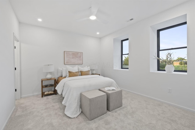 583 E Walnut St, Columbus, OH 43215 - bedroom with light carpet, recessed lighting, and ceiling fan