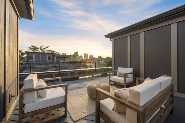 583 E Walnut St, Columbus, OH 43215 - deck at dusk featuring an outdoor living space