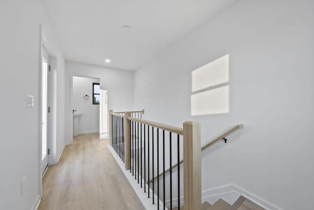 583 E Walnut St, Columbus, OH 43215 - hall featuring an upstairs landing, light wood finished floors, and recessed lighting