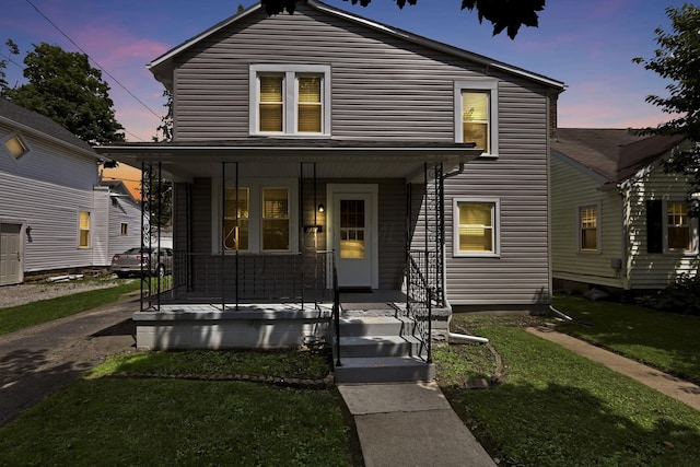 716 N Mount Pleasant Ave, Lancaster, OH 43130 - view of front of house with covered porch and a front lawn