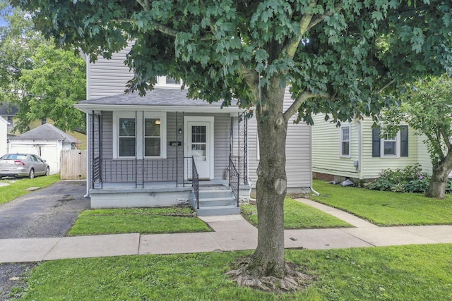 716 N Mount Pleasant Ave, Lancaster, OH 43130 - view of front of home with a porch, a front lawn, driveway, and roof with shingles
