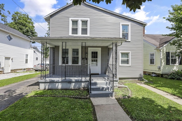 716 N Mount Pleasant Ave, Lancaster, OH 43130 - view of front of home featuring a porch and a front yard