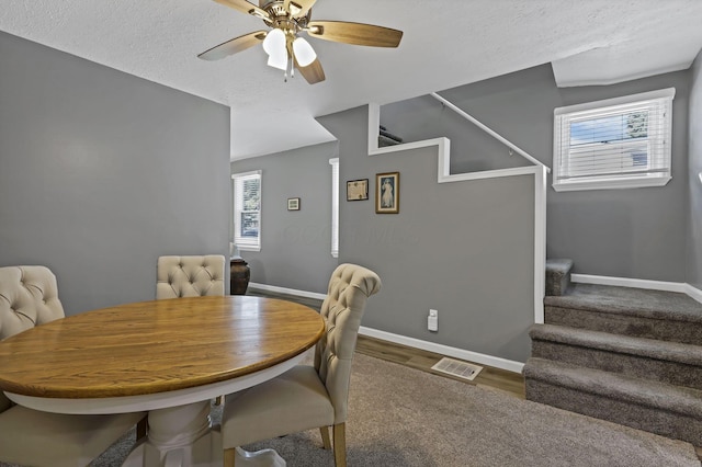 716 N Mount Pleasant Ave, Lancaster, OH 43130 - dining area with stairs, ceiling fan, wood finished floors, and a textured ceiling