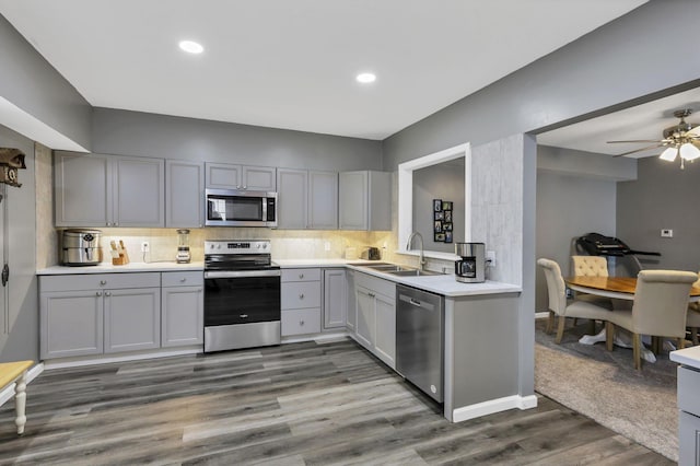 716 N Mount Pleasant Ave, Lancaster, OH 43130 - kitchen featuring stainless steel appliances, gray cabinetry, light countertops, tasteful backsplash, and a ceiling fan