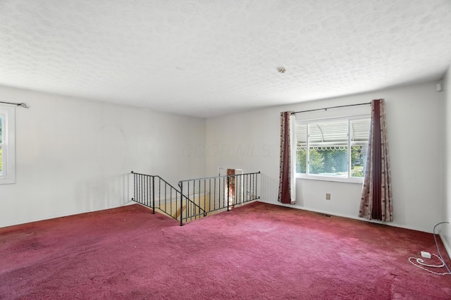 617 Athens St, Columbus, OH 43204 - unfurnished room featuring carpet flooring and a textured ceiling