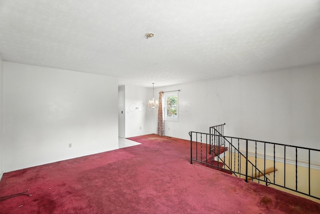 617 Athens St, Columbus, OH 43204 - carpeted empty room featuring a chandelier and baseboards