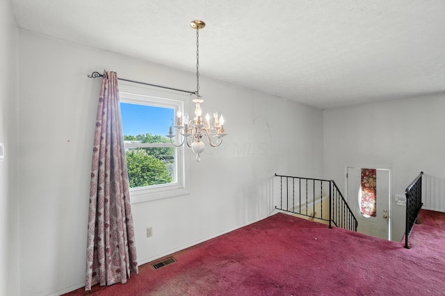 617 Athens St, Columbus, OH 43204 - carpeted spare room featuring a chandelier and baseboards