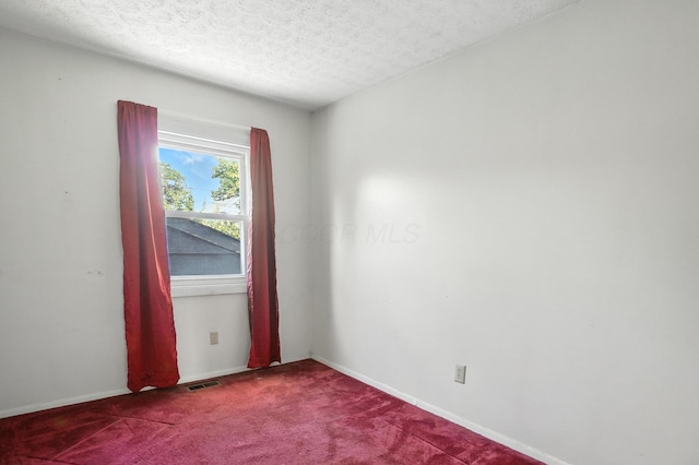 617 Athens St, Columbus, OH 43204 - carpeted spare room with a textured ceiling and baseboards