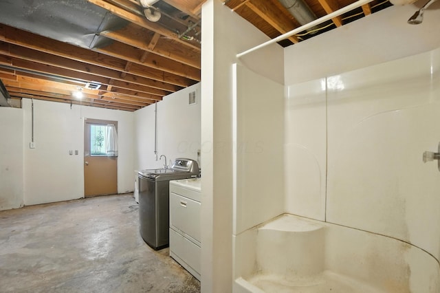 617 Athens St, Columbus, OH 43204 - below grade area featuring washing machine and clothes dryer