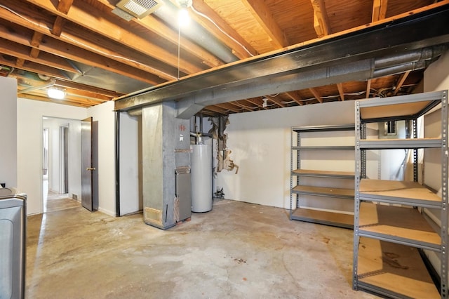 617 Athens St, Columbus, OH 43204 - unfinished below grade area featuring water heater, washer / clothes dryer, and heating unit