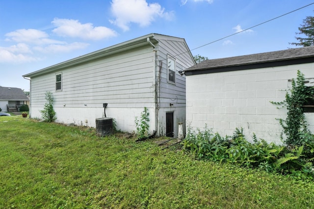 617 Athens St, Columbus, OH 43204 - view of home's exterior featuring a yard and a central air condition unit