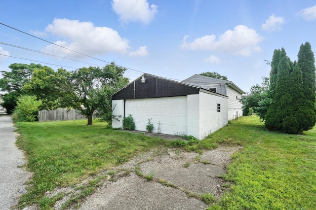 617 Athens St, Columbus, OH 43204 - view of property exterior featuring a garage, an outbuilding, and concrete block siding