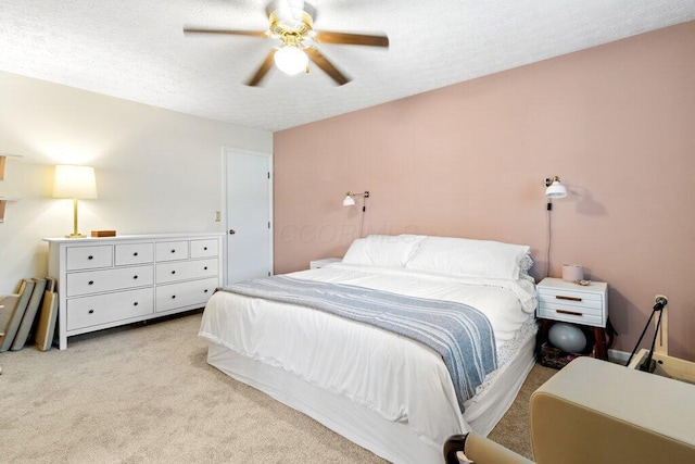 7107 Stone Ct, Columbus, OH 43235 - bedroom with light carpet, a textured ceiling, and a ceiling fan