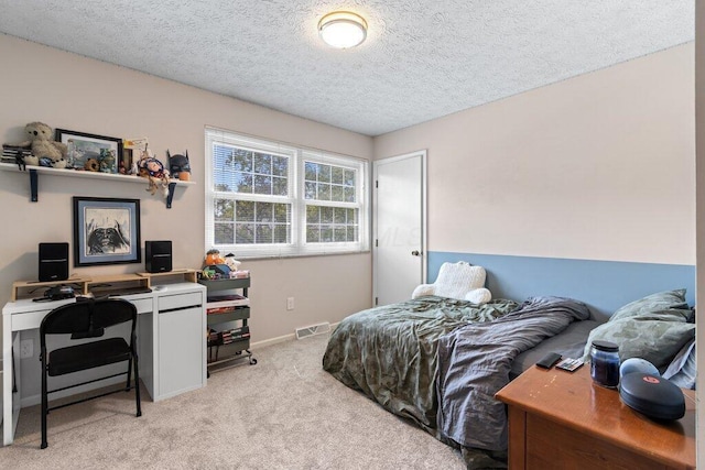 7107 Stone Ct, Columbus, OH 43235 - bedroom with light colored carpet, a textured ceiling, and a desk