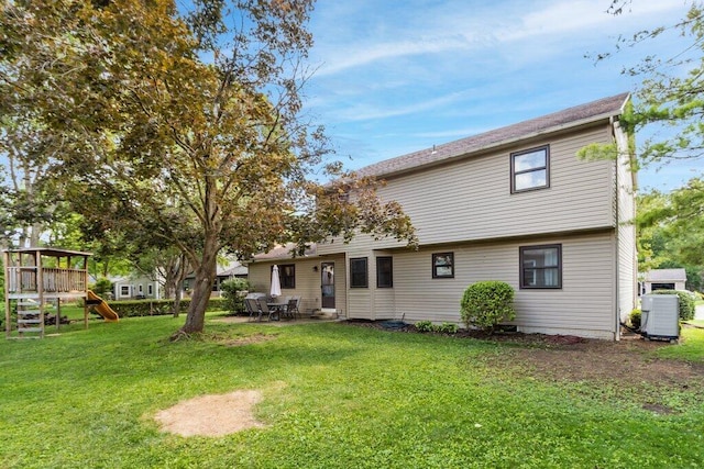 7107 Stone Ct, Columbus, OH 43235 - rear view of property with a playground and a lawn