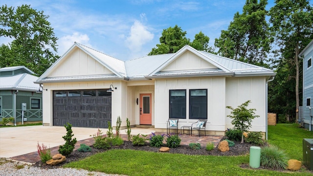 58 Lippert Ln, Buckeye Lake, OH 43008 - modern inspired farmhouse with a garage, driveway, board and batten siding, a metal roof, and a front lawn