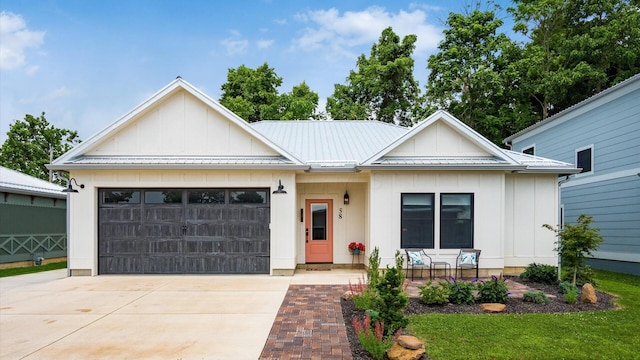 58 Lippert Ln, Buckeye Lake, OH 43008 - ranch-style home featuring board and batten siding, driveway, an attached garage, and a metal roof
