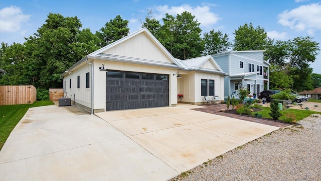58 Lippert Ln, Buckeye Lake, OH 43008 - modern farmhouse with board and batten siding, concrete driveway, a garage, and a metal roof