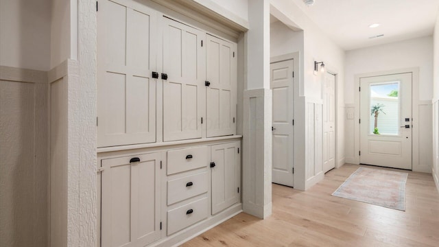 58 Lippert Ln, Buckeye Lake, OH 43008 - foyer featuring light wood-type flooring and a wainscoted wall
