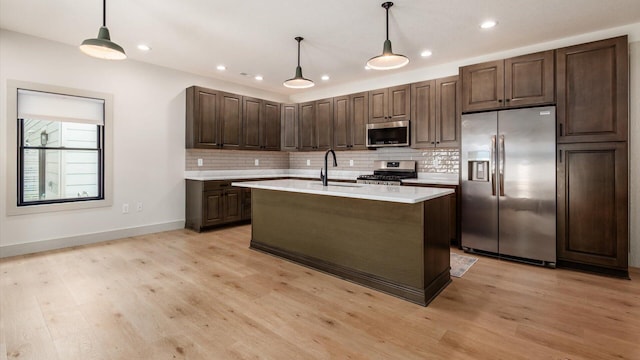 58 Lippert Ln, Buckeye Lake, OH 43008 - kitchen with appliances with stainless steel finishes, light countertops, tasteful backsplash, recessed lighting, and light wood-style flooring