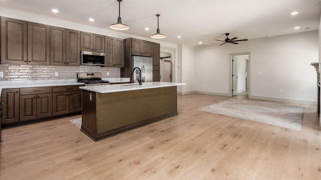 58 Lippert Ln, Buckeye Lake, OH 43008 - kitchen with appliances with stainless steel finishes, backsplash, a ceiling fan, light countertops, and recessed lighting