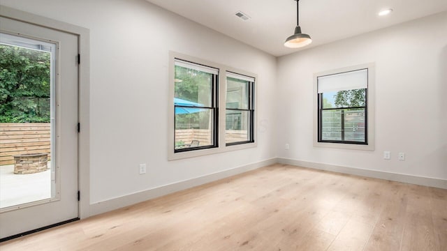 58 Lippert Ln, Buckeye Lake, OH 43008 - empty room with healthy amount of natural light, light wood finished floors, and recessed lighting