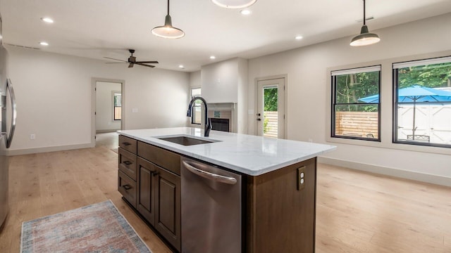 58 Lippert Ln, Buckeye Lake, OH 43008 - kitchen with stainless steel dishwasher, light wood finished floors, decorative light fixtures, dark brown cabinetry, and recessed lighting