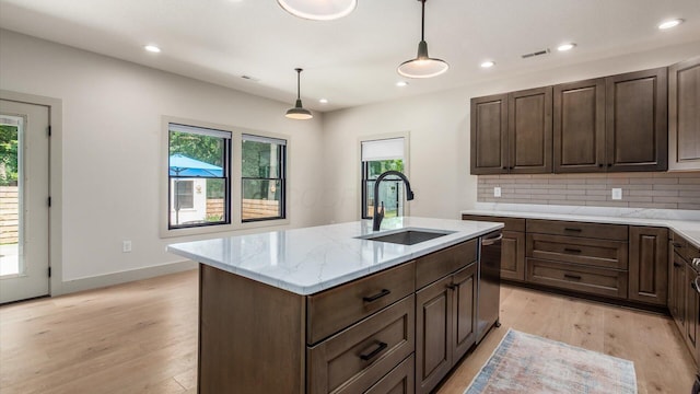 58 Lippert Ln, Buckeye Lake, OH 43008 - kitchen with healthy amount of natural light, light wood-type flooring, backsplash, pendant lighting, and recessed lighting