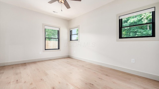 58 Lippert Ln, Buckeye Lake, OH 43008 - empty room with wood finished floors and a ceiling fan