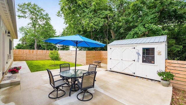 58 Lippert Ln, Buckeye Lake, OH 43008 - fenced backyard featuring a patio area, a storage shed, and outdoor dining area