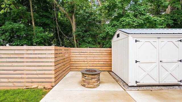 58 Lippert Ln, Buckeye Lake, OH 43008 - view of shed with a fire pit