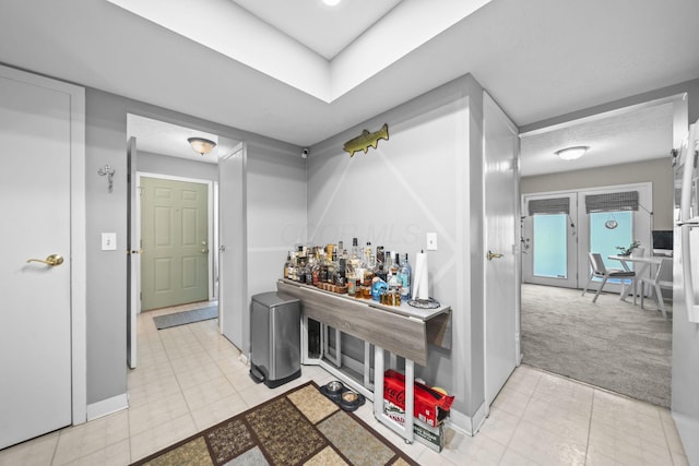 1290 Paddington Ct, Columbus, OH 43230 - hallway with light tile patterned floors and light colored carpet