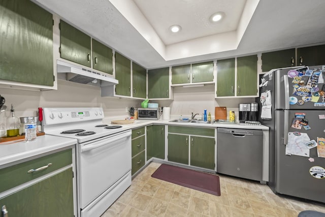 1290 Paddington Ct, Columbus, OH 43230 - kitchen featuring stainless steel appliances, green cabinets, under cabinet range hood, light countertops, and a tray ceiling