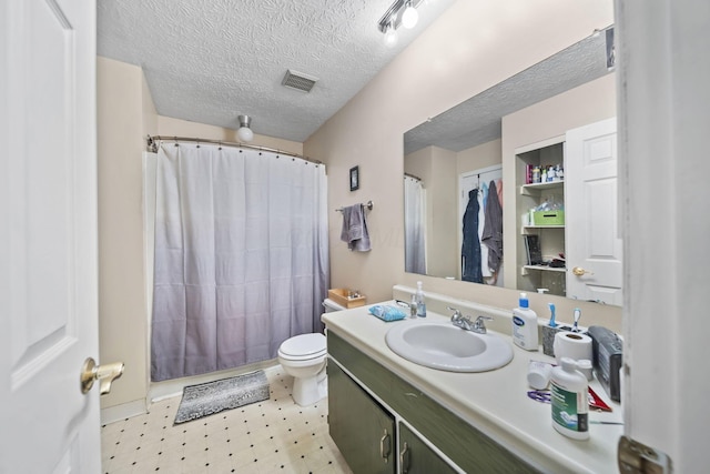 1290 Paddington Ct, Columbus, OH 43230 - bathroom with vanity, tile patterned floors, and a textured ceiling