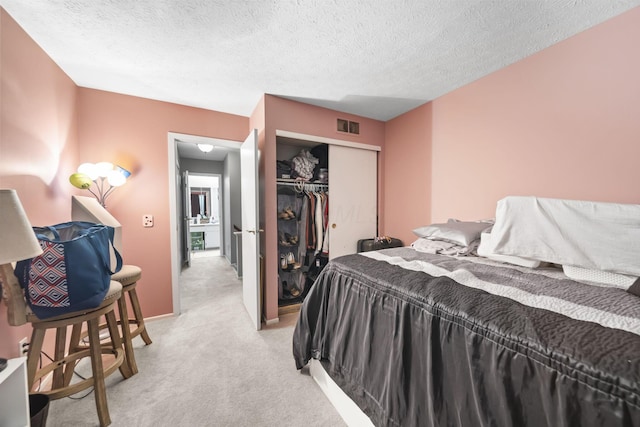 1290 Paddington Ct, Columbus, OH 43230 - bedroom with light colored carpet, a closet, and a textured ceiling