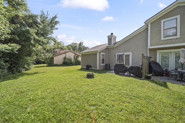 1290 Paddington Ct, Columbus, OH 43230 - view of green lawn with a patio area