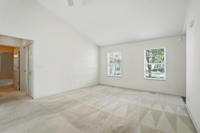 6281 Mcnaughten Place Ln Unit 24, Columbus, OH 43213 - empty room featuring light carpet and high vaulted ceiling