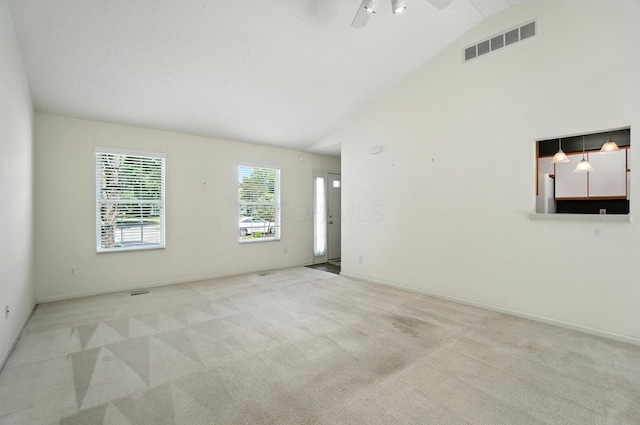 6281 Mcnaughten Place Ln Unit 24, Columbus, OH 43213 - empty room featuring ceiling fan, light colored carpet, and high vaulted ceiling