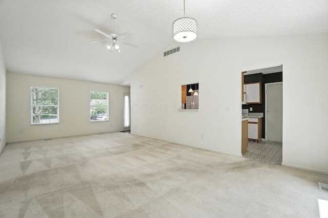 6281 Mcnaughten Place Ln Unit 24, Columbus, OH 43213 - spare room with a ceiling fan, light colored carpet, and high vaulted ceiling
