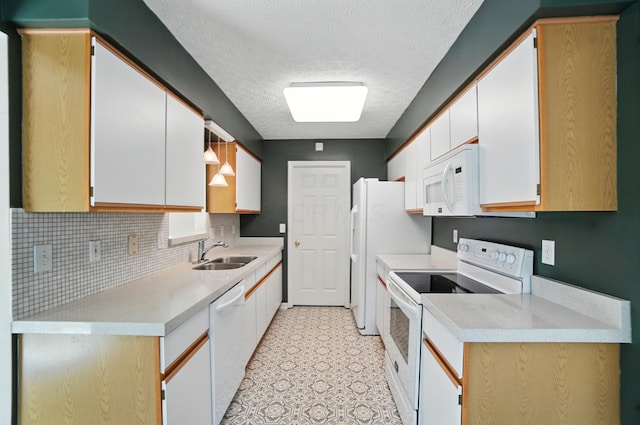 6281 Mcnaughten Place Ln Unit 24, Columbus, OH 43213 - kitchen with white appliances, light countertops, tasteful backsplash, a textured ceiling, and light floors
