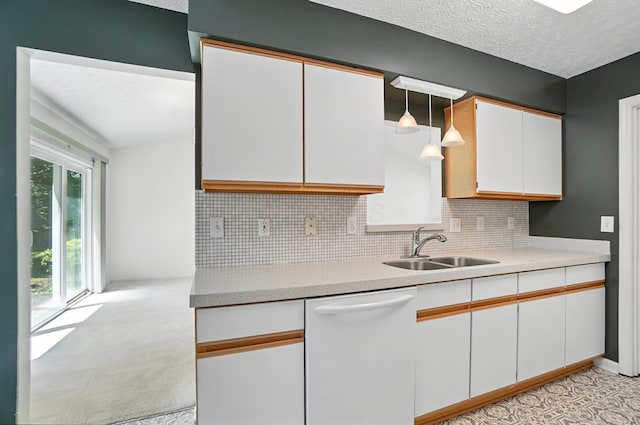 6281 Mcnaughten Place Ln Unit 24, Columbus, OH 43213 - kitchen featuring white dishwasher, white cabinets, backsplash, light countertops, and a textured ceiling