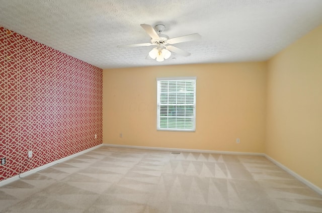 6281 Mcnaughten Place Ln Unit 24, Columbus, OH 43213 - carpeted empty room with a ceiling fan and an accent wall