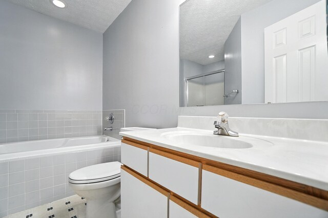 6281 Mcnaughten Place Ln Unit 24, Columbus, OH 43213 - full bathroom with a textured ceiling, vanity, a bath, tile patterned flooring, and a shower