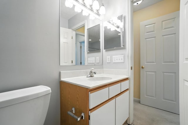 6281 Mcnaughten Place Ln Unit 24, Columbus, OH 43213 - half bathroom with vanity and a textured ceiling